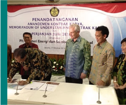 Five people from different ethnic groups sign agreement.