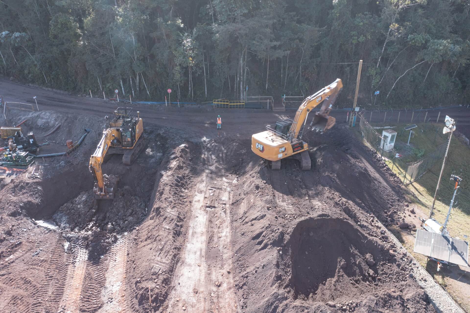 Tractors digging up earth