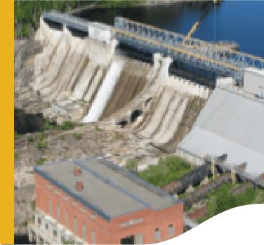 Photo of Big Eddy small hydropower plant with a concrete structure and water.