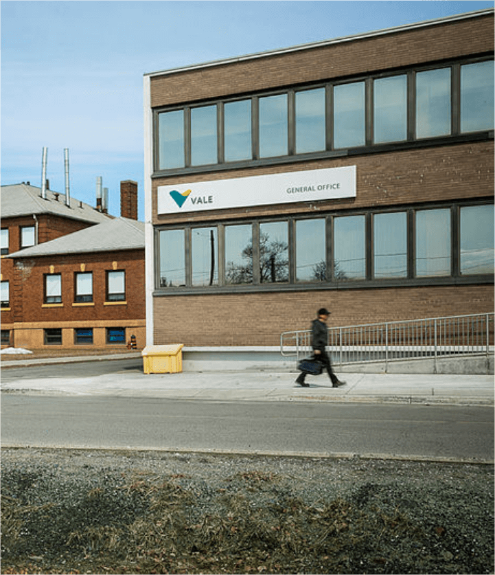 Entrance to Vale's general office in Canada. A two-storey building with mirrored windows and the Vale logo