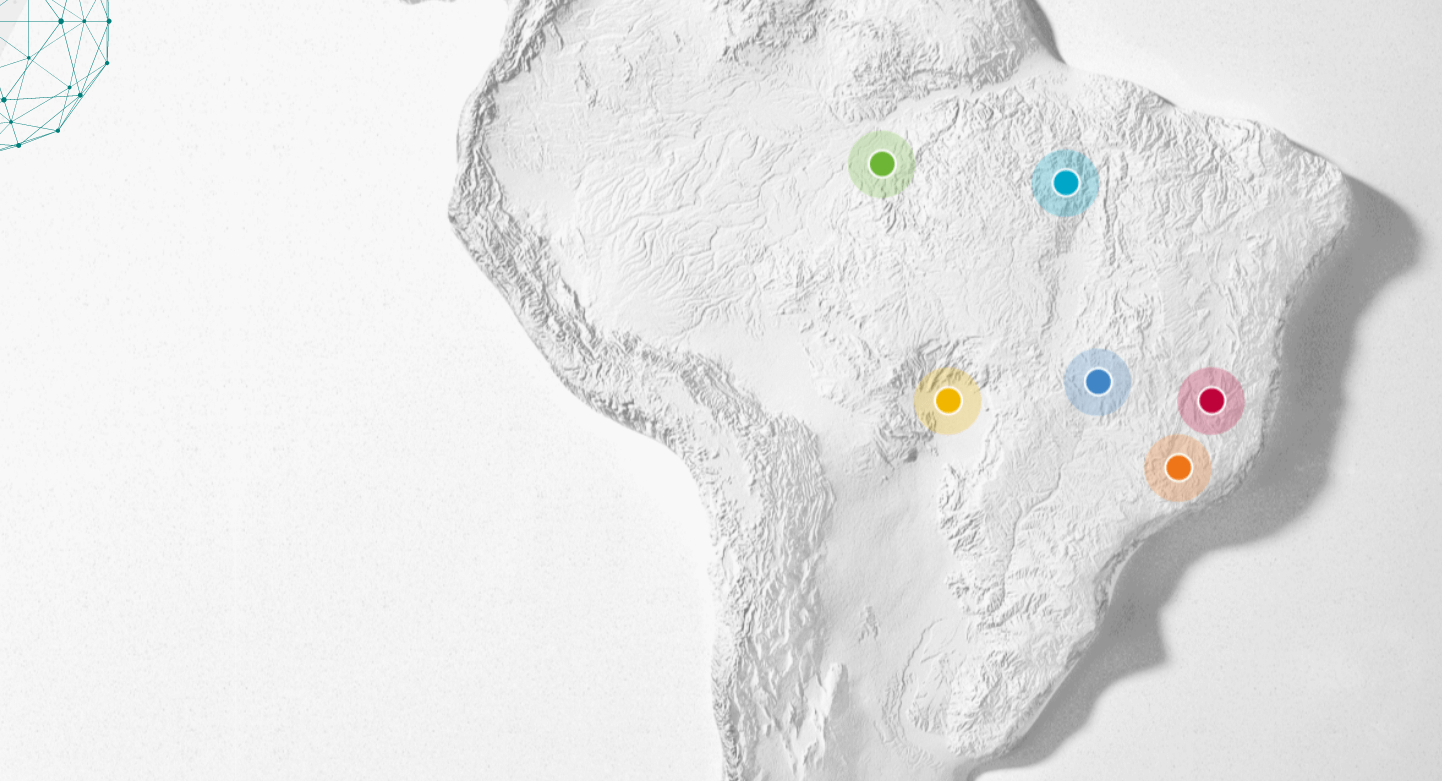 Imagem do mapa do Brasil pintado de branco com círculos coloridos localizados nos estados sem que a Vale está presente.